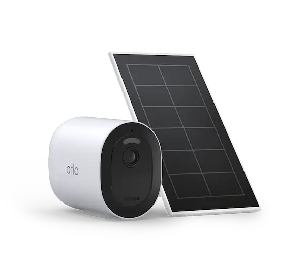 Arlo Pro 4 Spotlight Camera with solar panel installed on a house exterior.